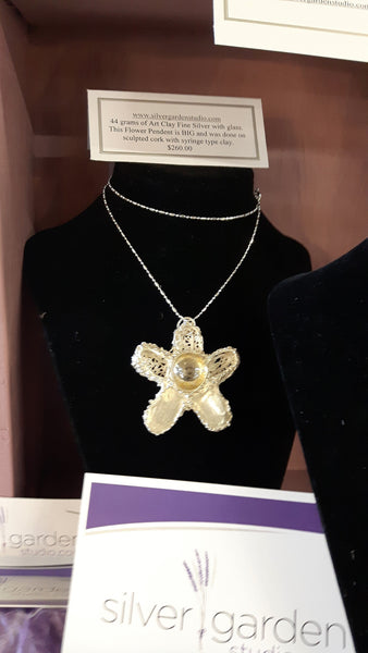 Large filligree flower with glass marble pendent